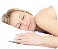 Radiant woman sleeping on her bed at home